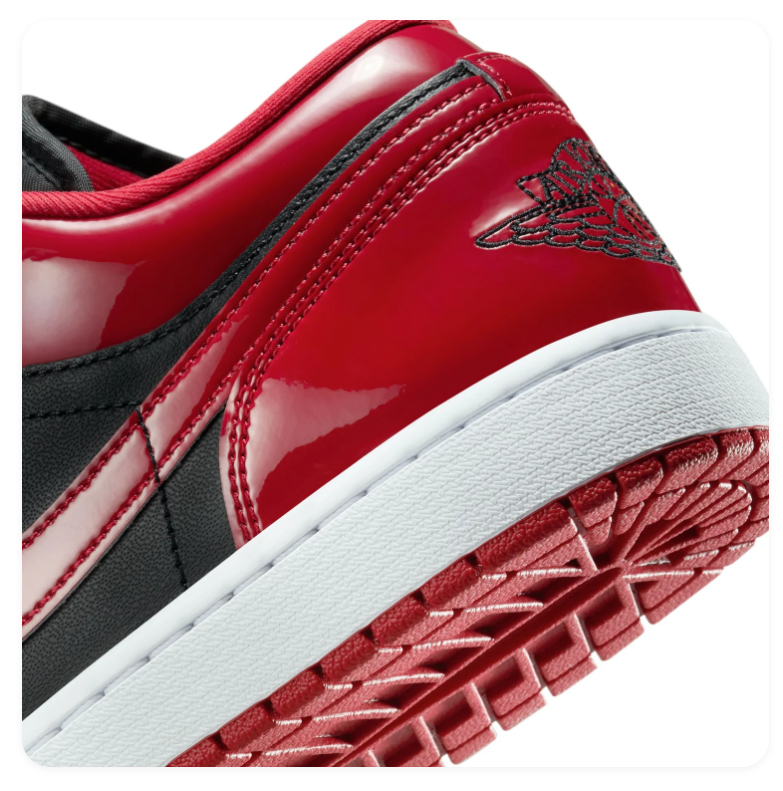 Air Jordan 1 Low Red and Black Sneakers with Glossy Overlays