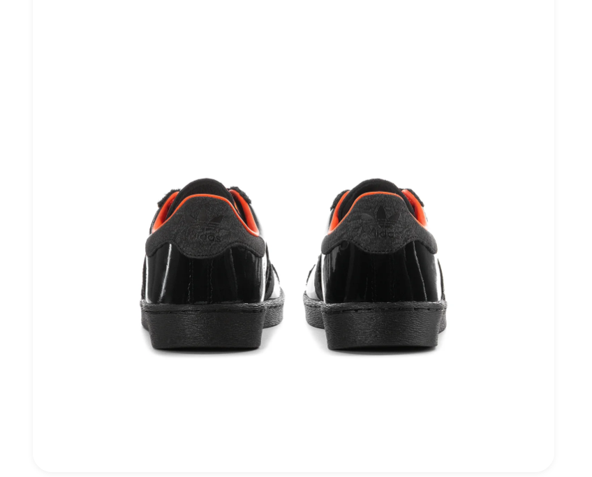 Adidas Black Low-Top Sneakers with Orange Lining and Graphic Tongue
