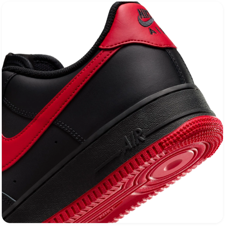 Nike Air Force 1 Black Low-Top Sneakers with Red Swoosh and Outsole