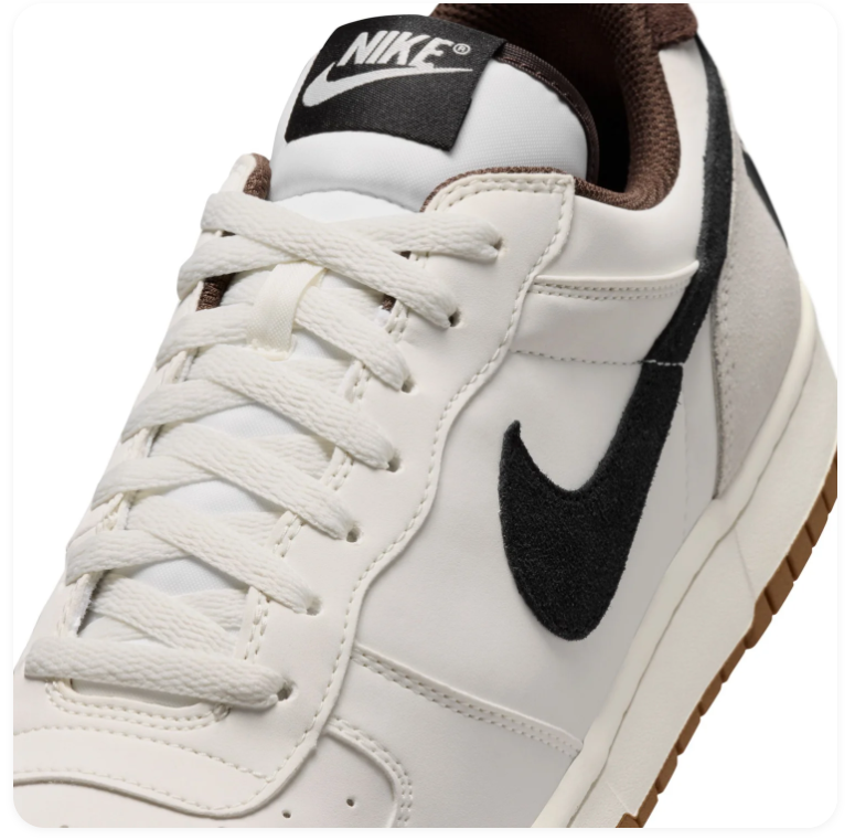 Nike White and Cream Low-Top Sneakers with Black Swoosh and Gum Sole