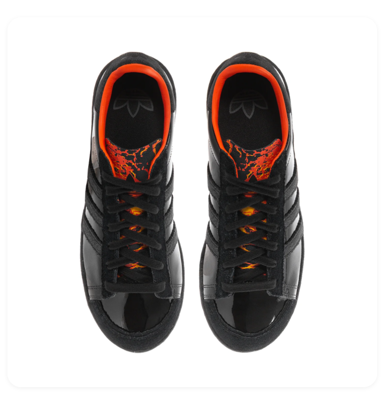 Adidas Black Low-Top Sneakers with Orange Lining and Graphic Tongue